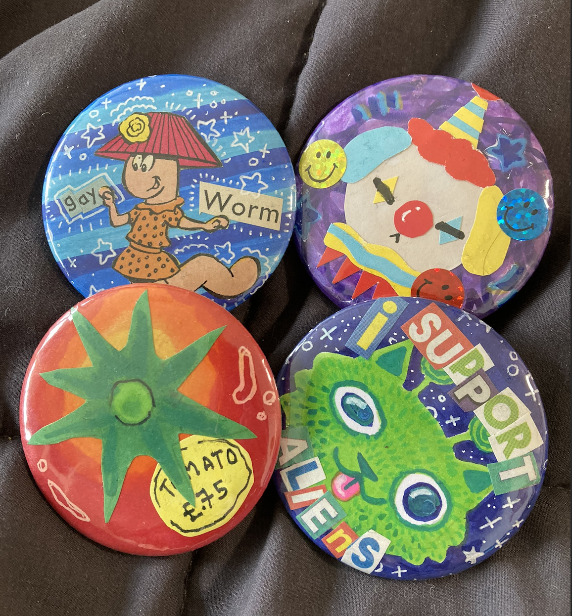 4 colourful badges
