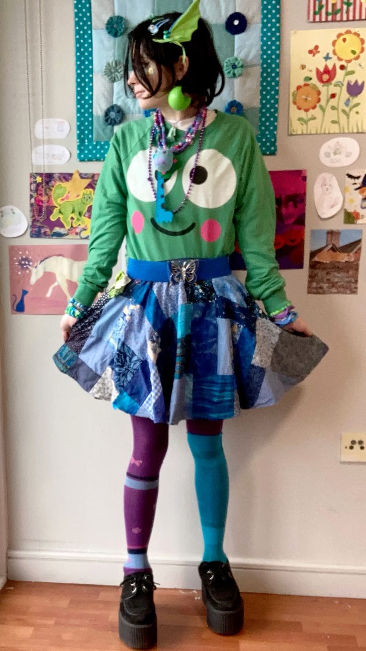 person in green and blue outfit