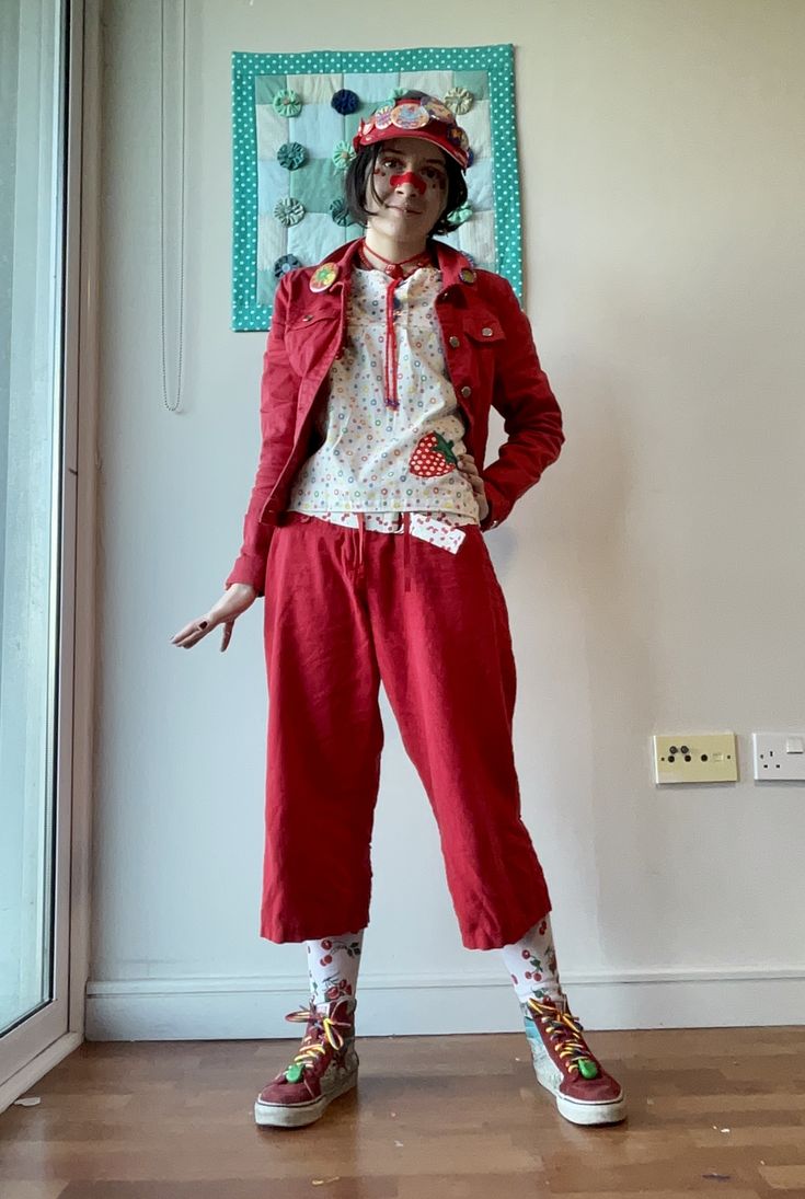 person in red strawberry themed outfit