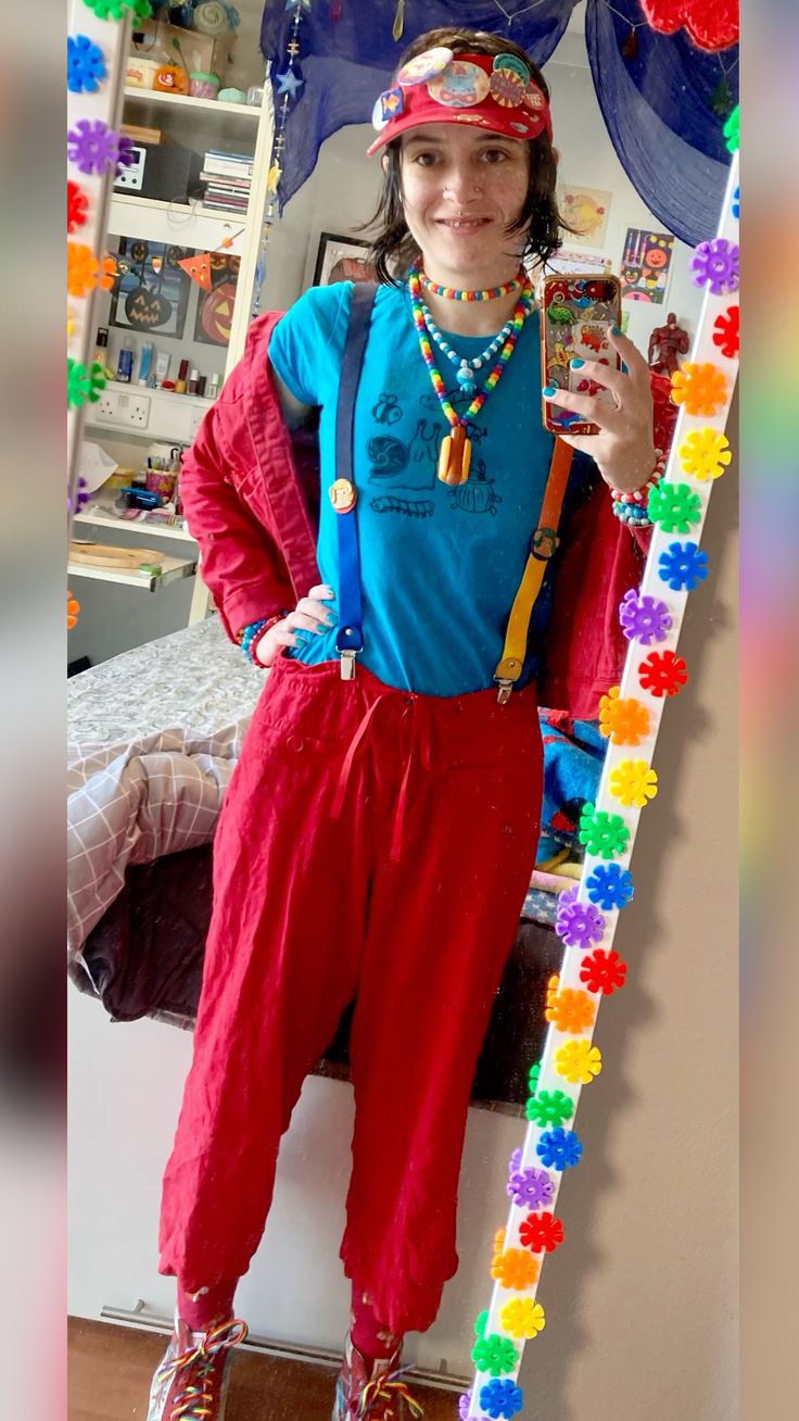 person in blue and red outfit with suspenders