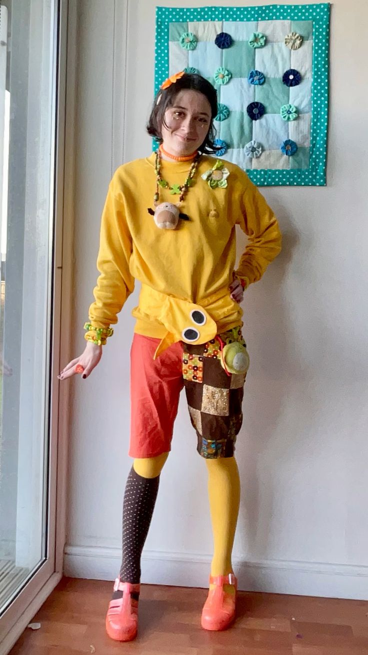 person in yellow outfit with a cute snake belt