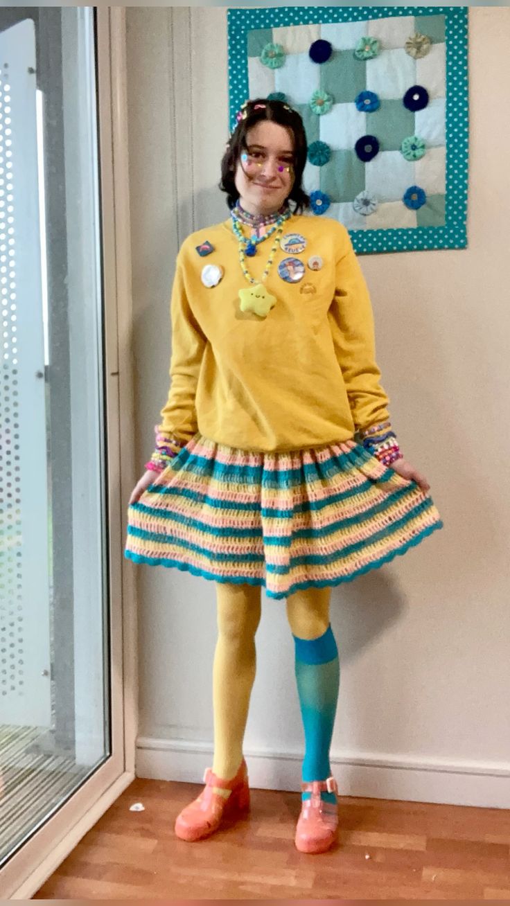 person in outfit with yellow jumper and crochet skirt