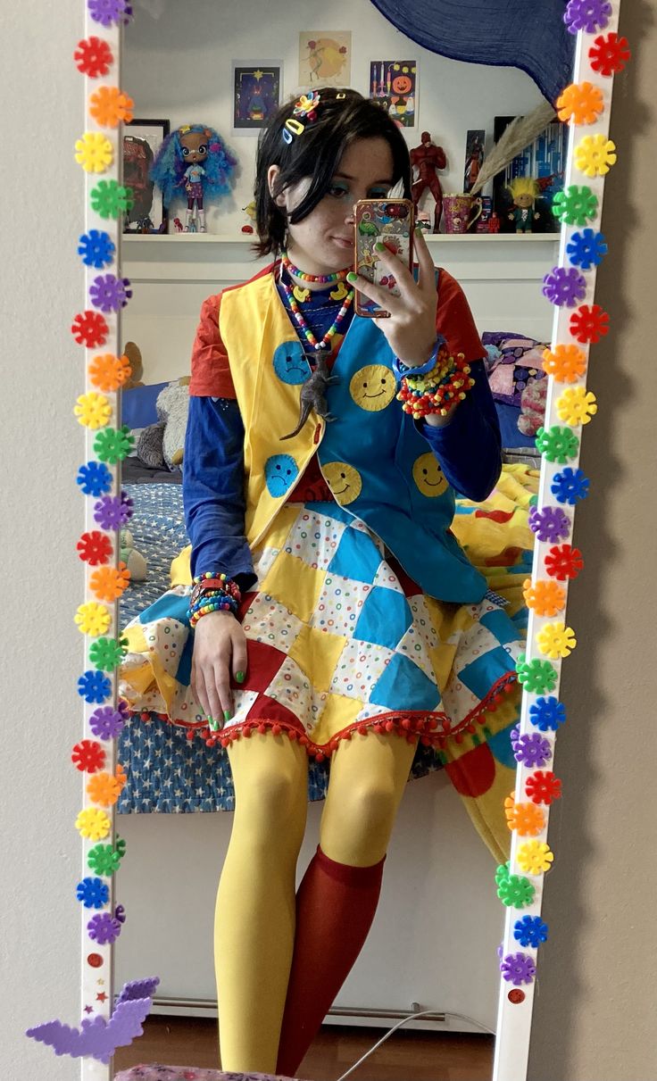 A mirror selfie of a person wearing a primary colored outfit.