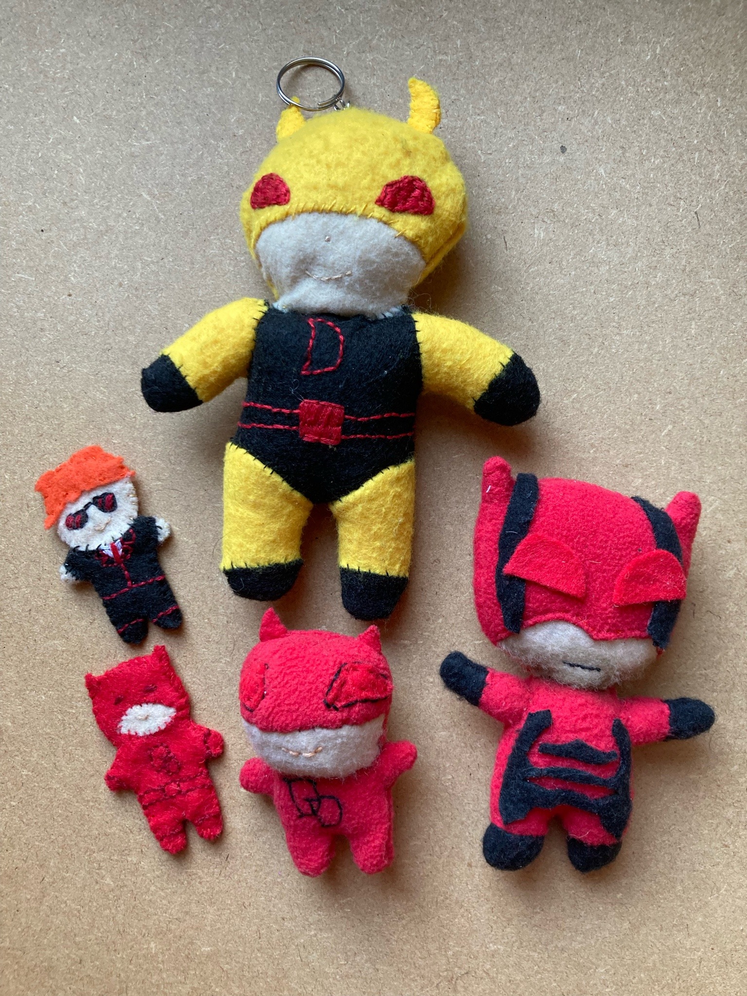 5 small handmade Daredevil plushies.